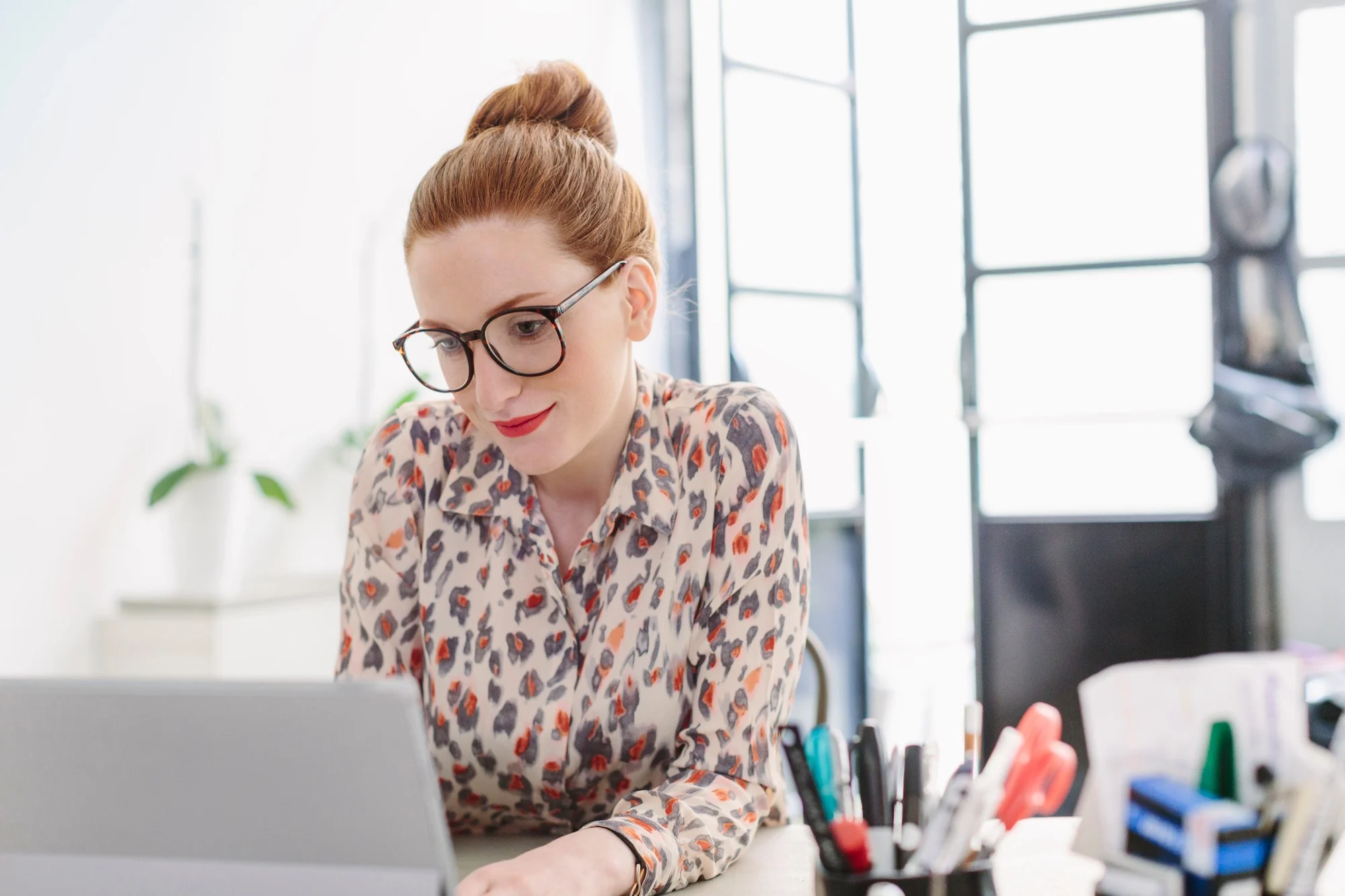 Woman in office using computer